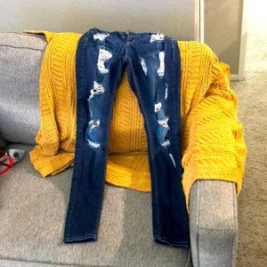 Skinny distressed dark denim